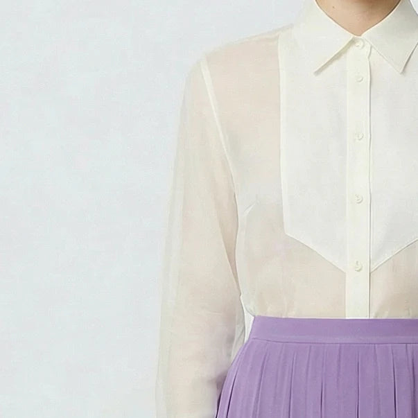 Close up view of organza button down tuxido shirt on model in creme color
