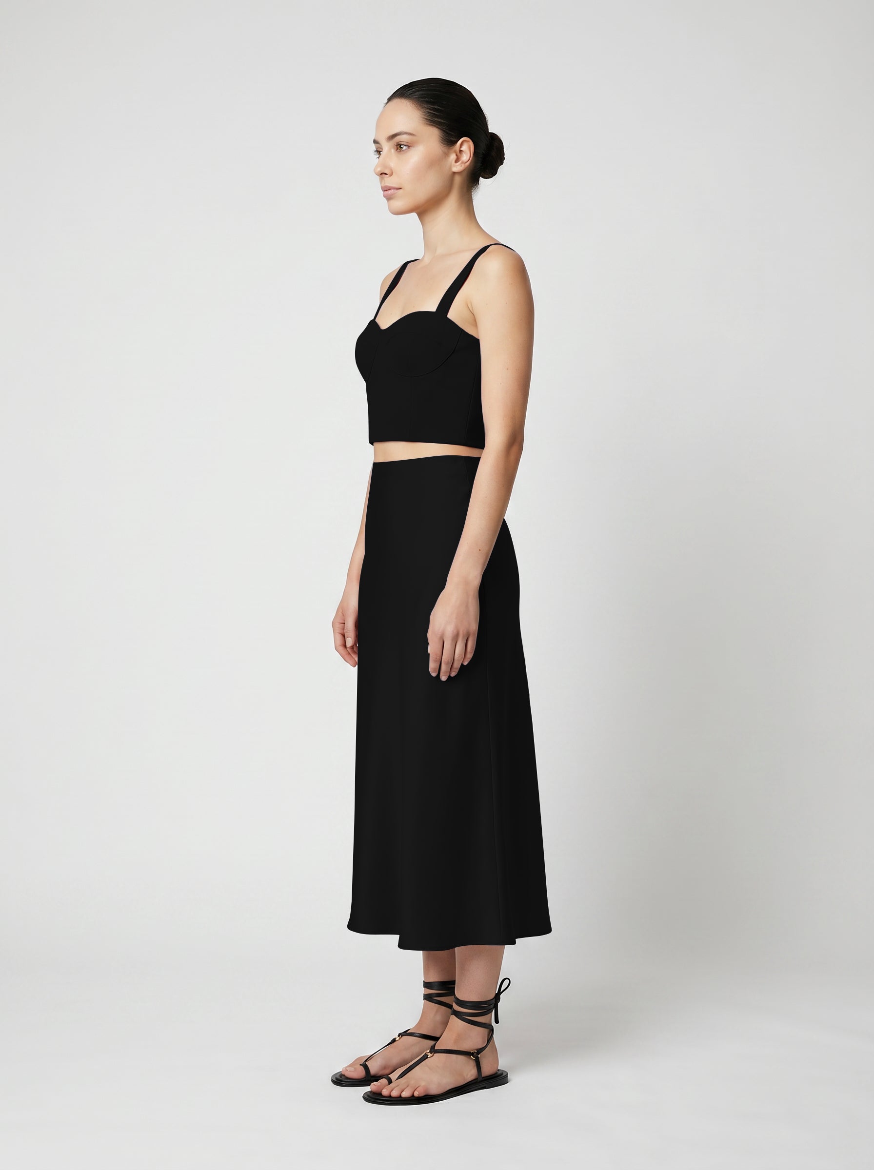 Black Wool corset top with silk slip  skirt on model siide view