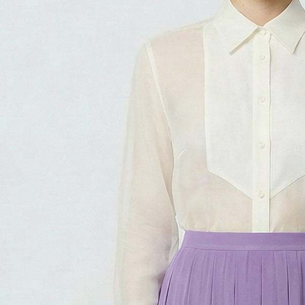 White sheer blouse with a purple skirt on a white background