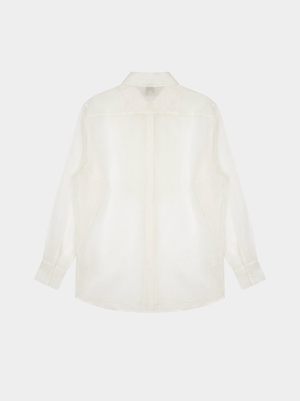 creme white shirt on a light beige background back view