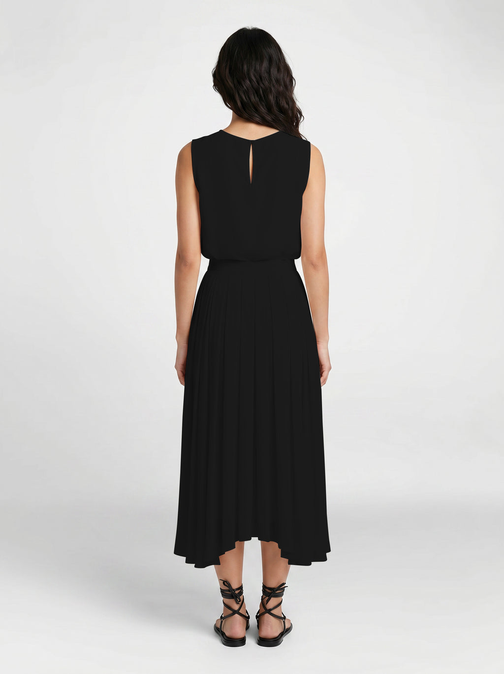 black pleated organic silk skirt on model back view