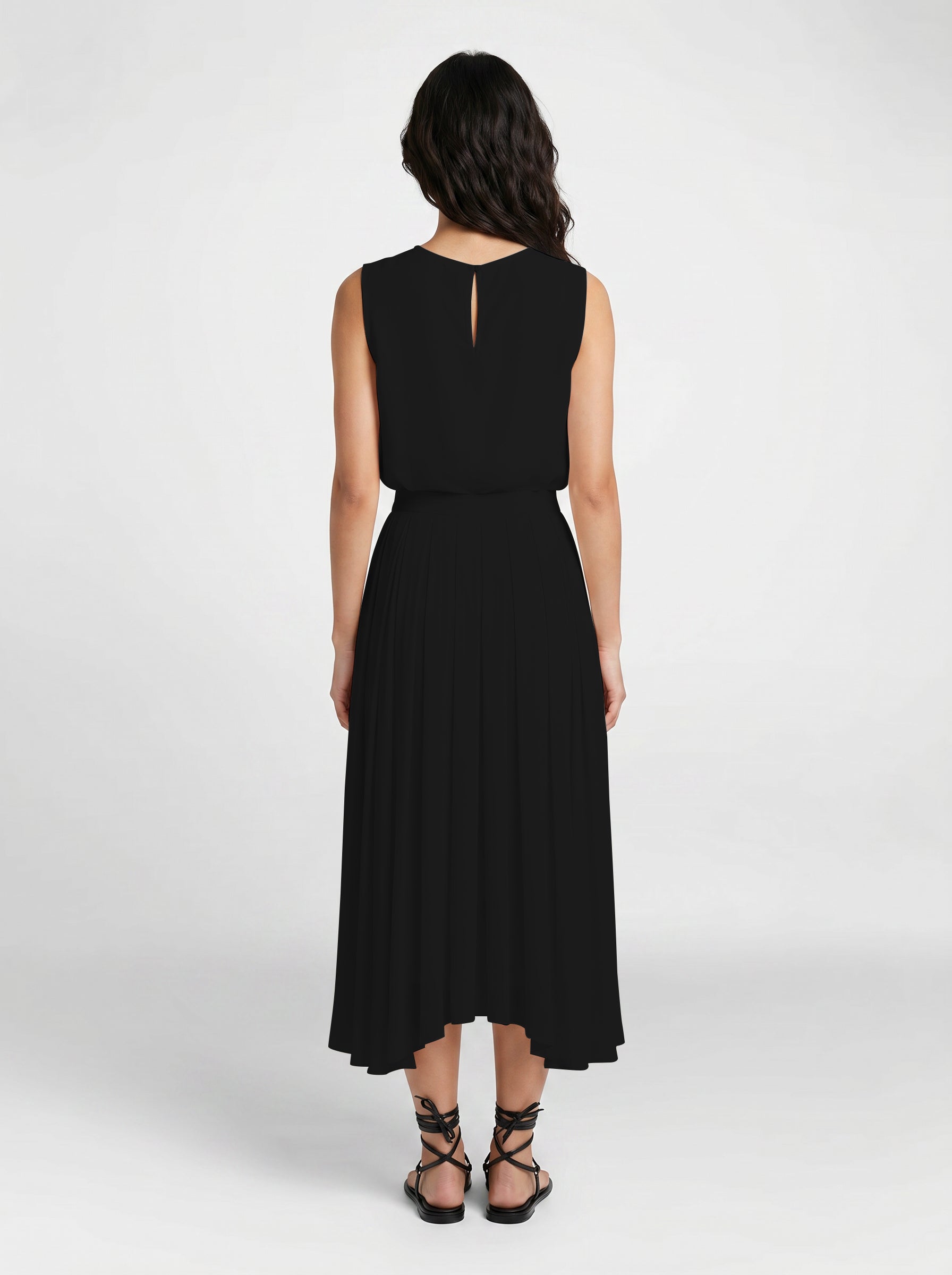 black pleated organic silk skirt on model back view
