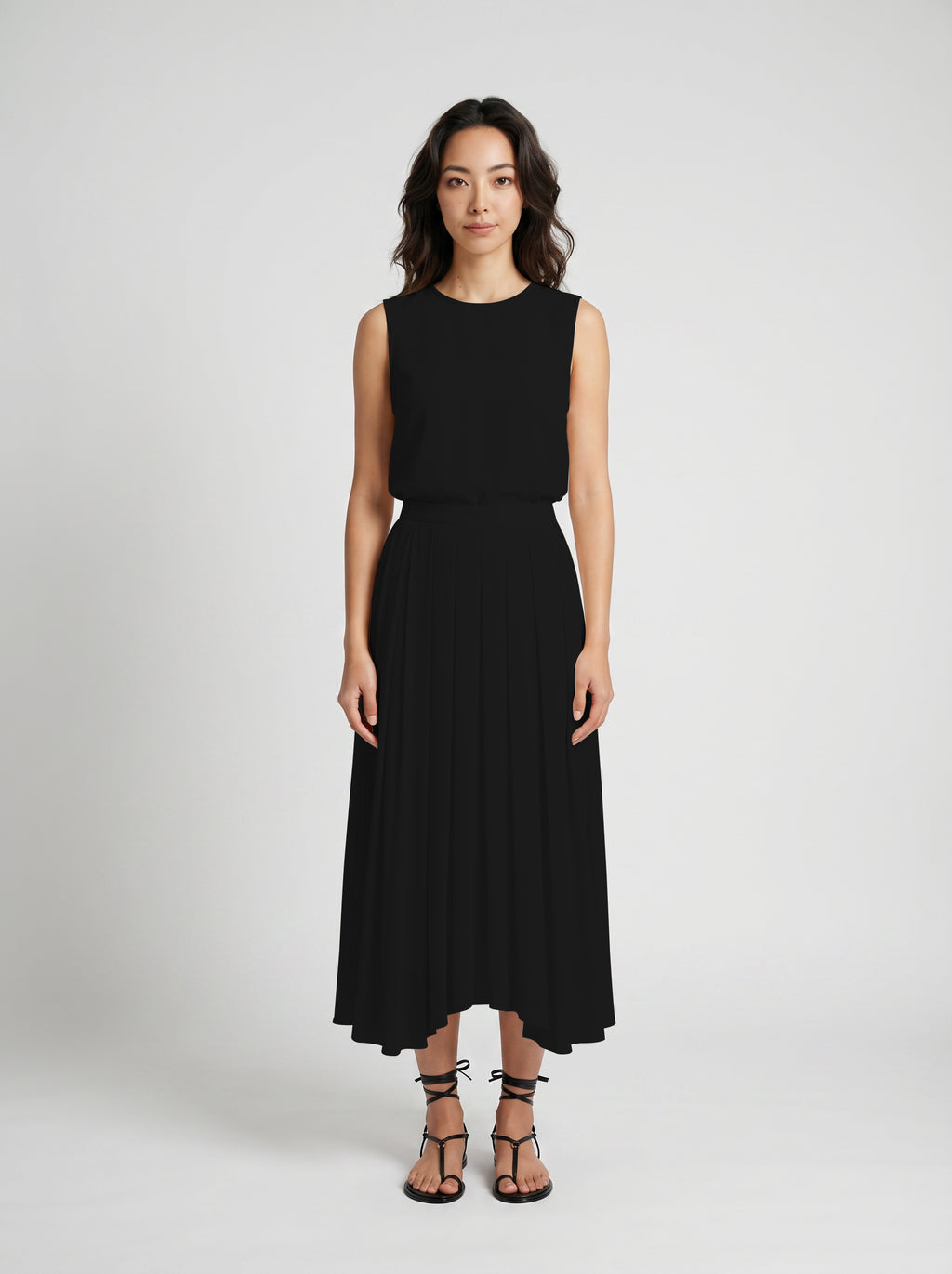 black pleated organic silk skirt on model front view