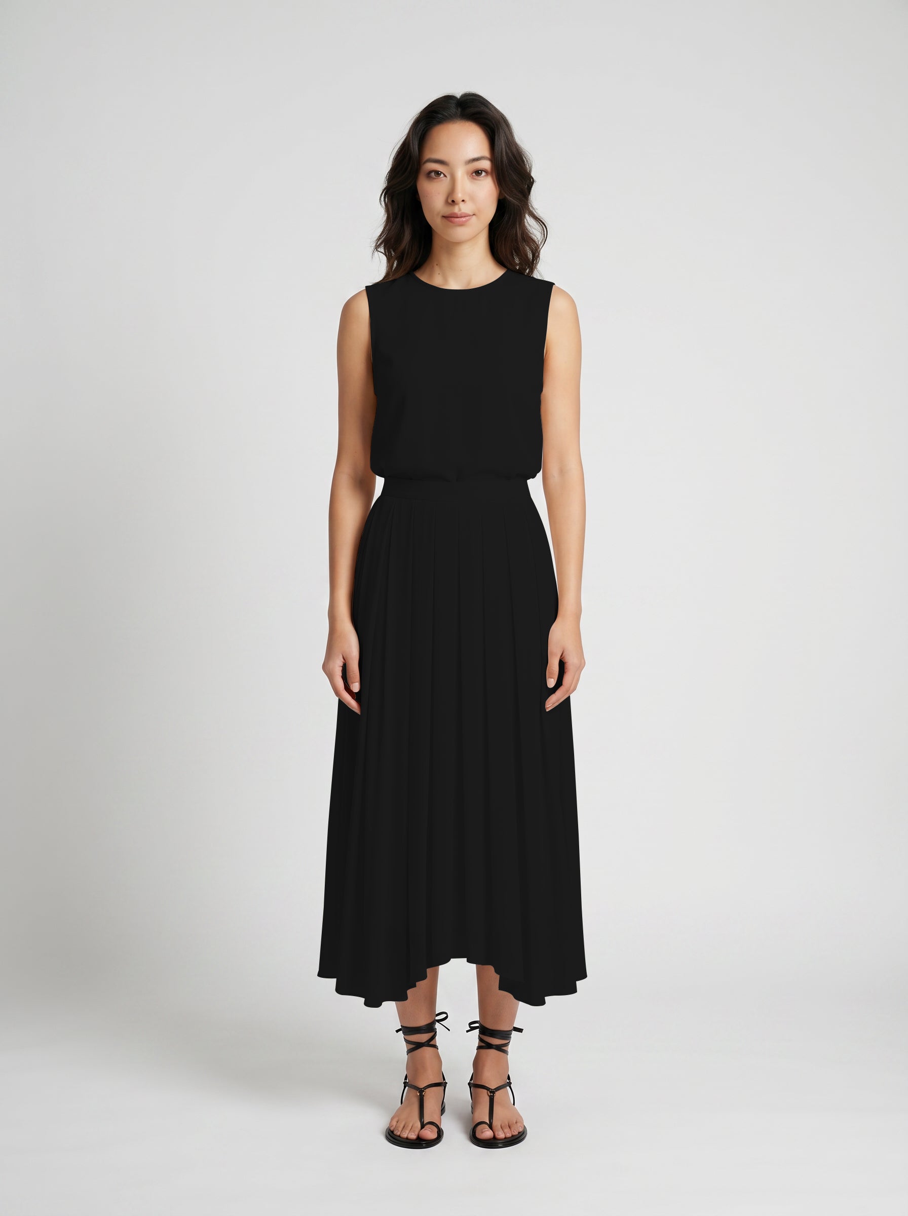 black pleated organic silk skirt on model front view