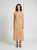 blush pleated organic silk skirt on model front view