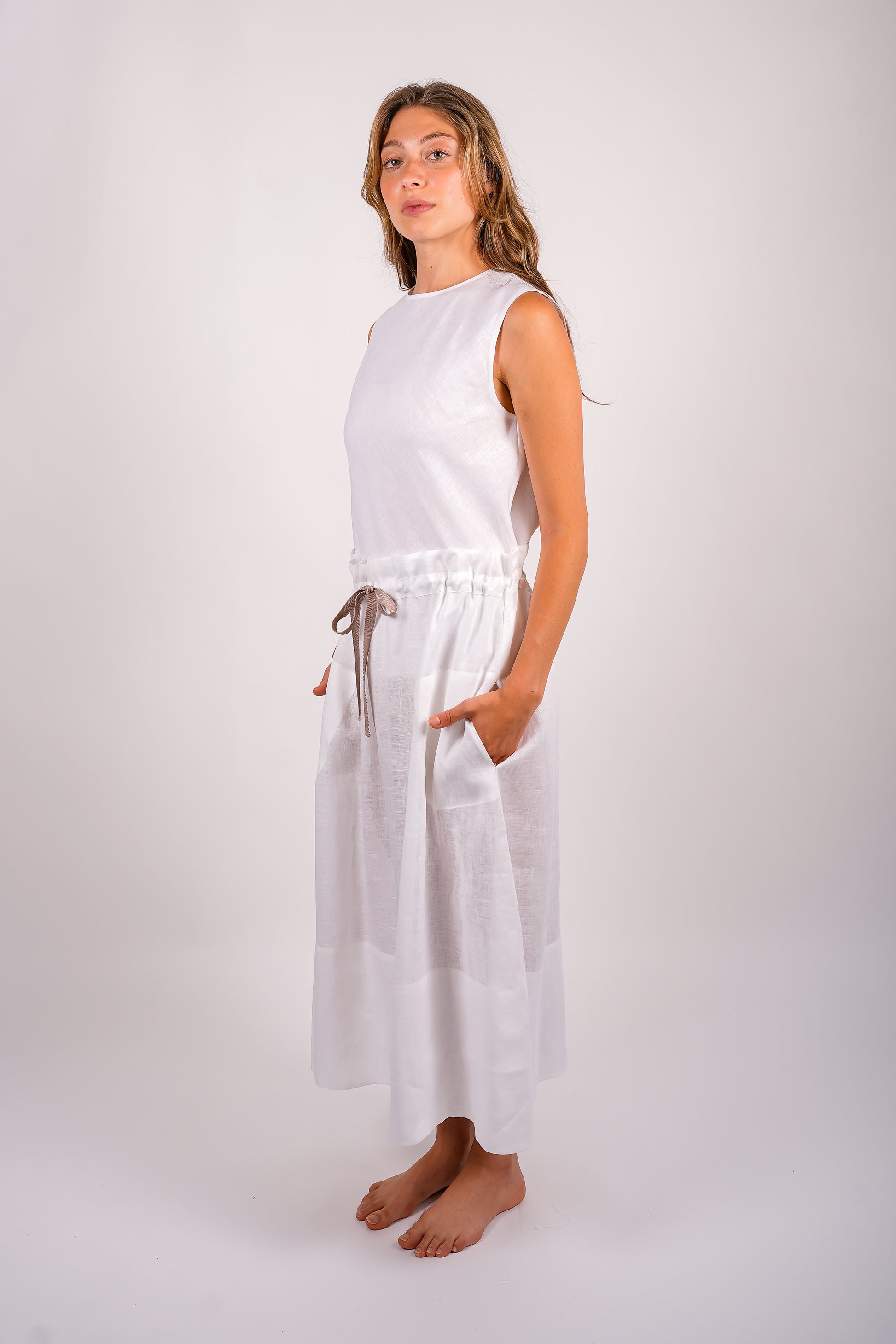 gathered-skirt-linen-sustainable-white-american-made-side-view-hands-in-pockets