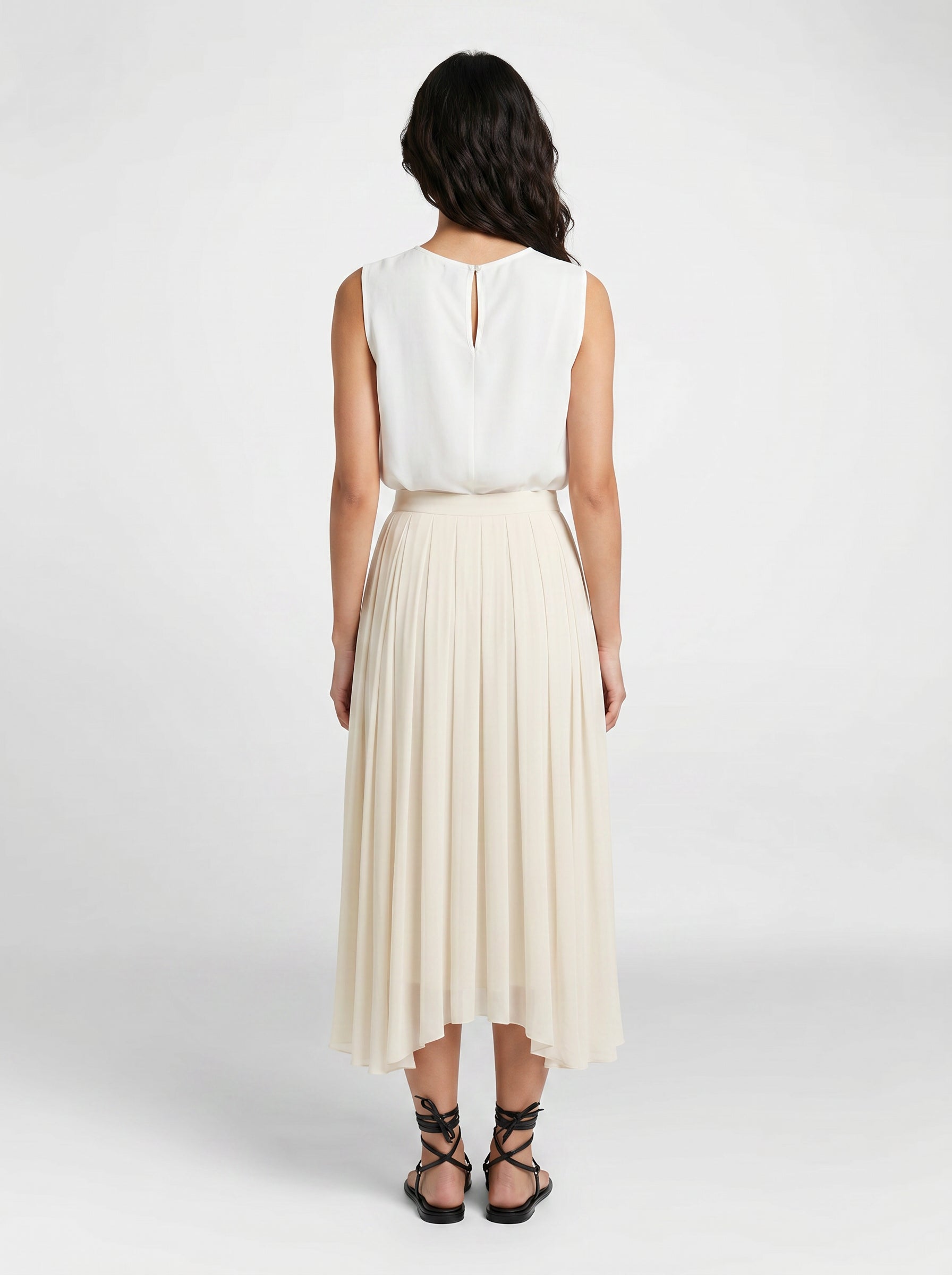 creme pleated organic silk skirt on model back view