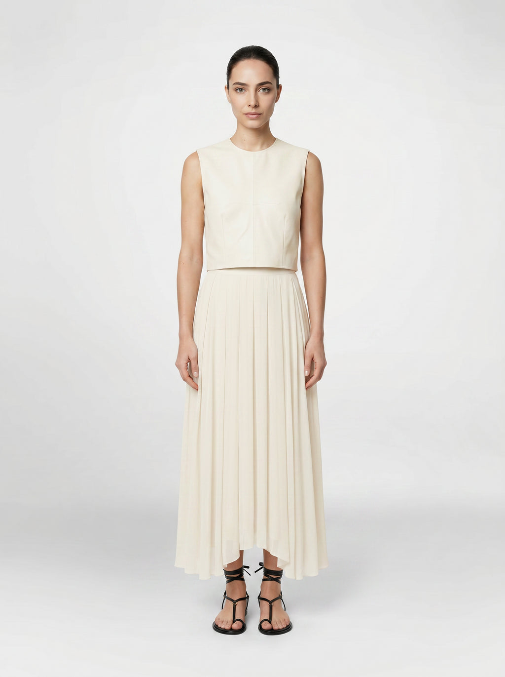 creme color Wool bodice top with silk pleated skirt on model front view