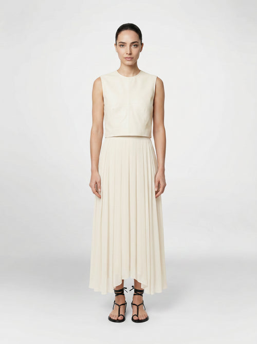 creme color Wool bodice top with silk pleated skirt on model front view