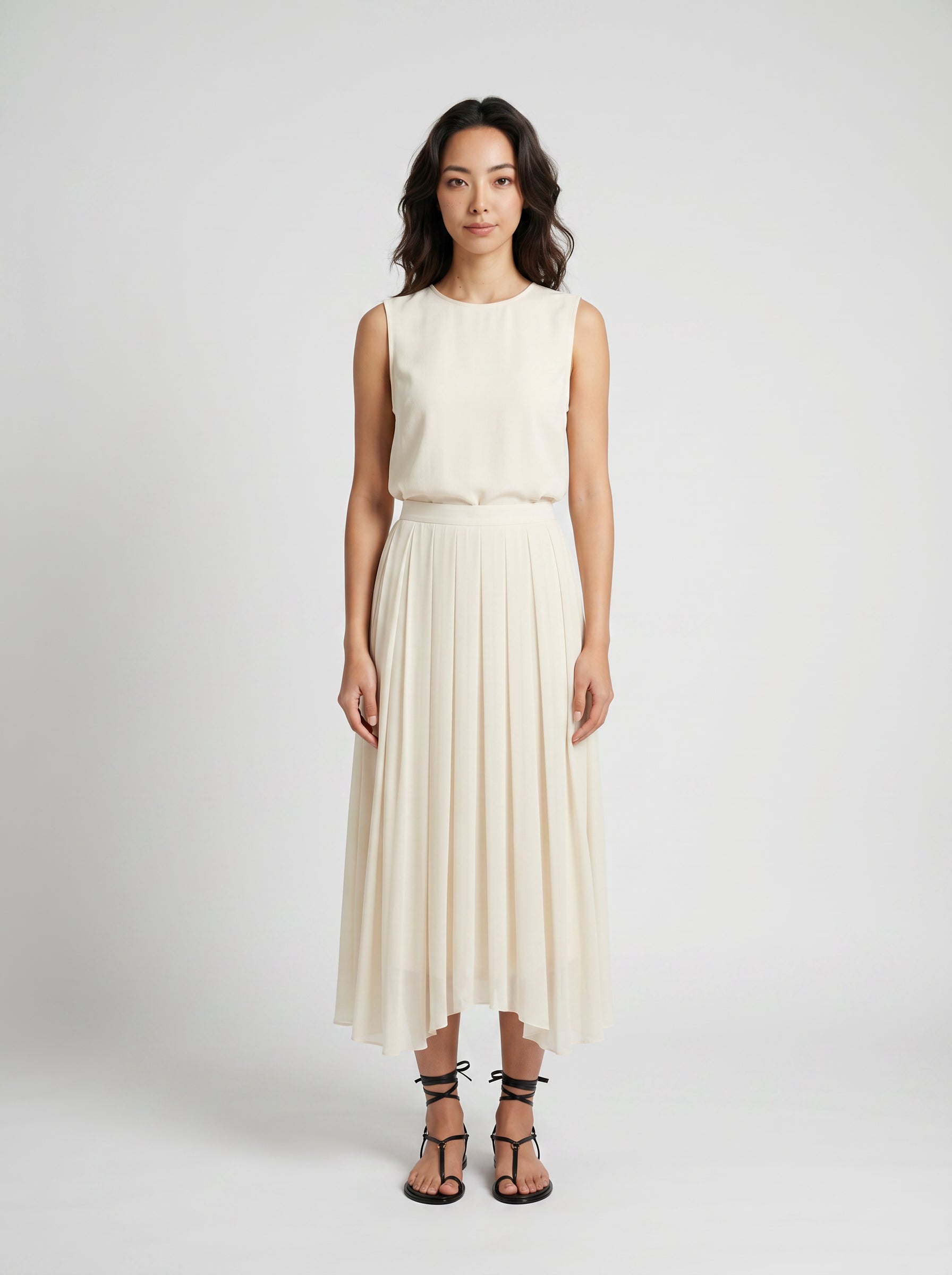 creme pleated organic silk skirt on model front view
