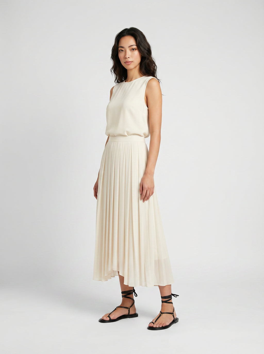creme pleated organic silk skirt on model three quarter view