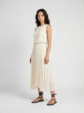 creme pleated organic silk skirt on model three quarter view