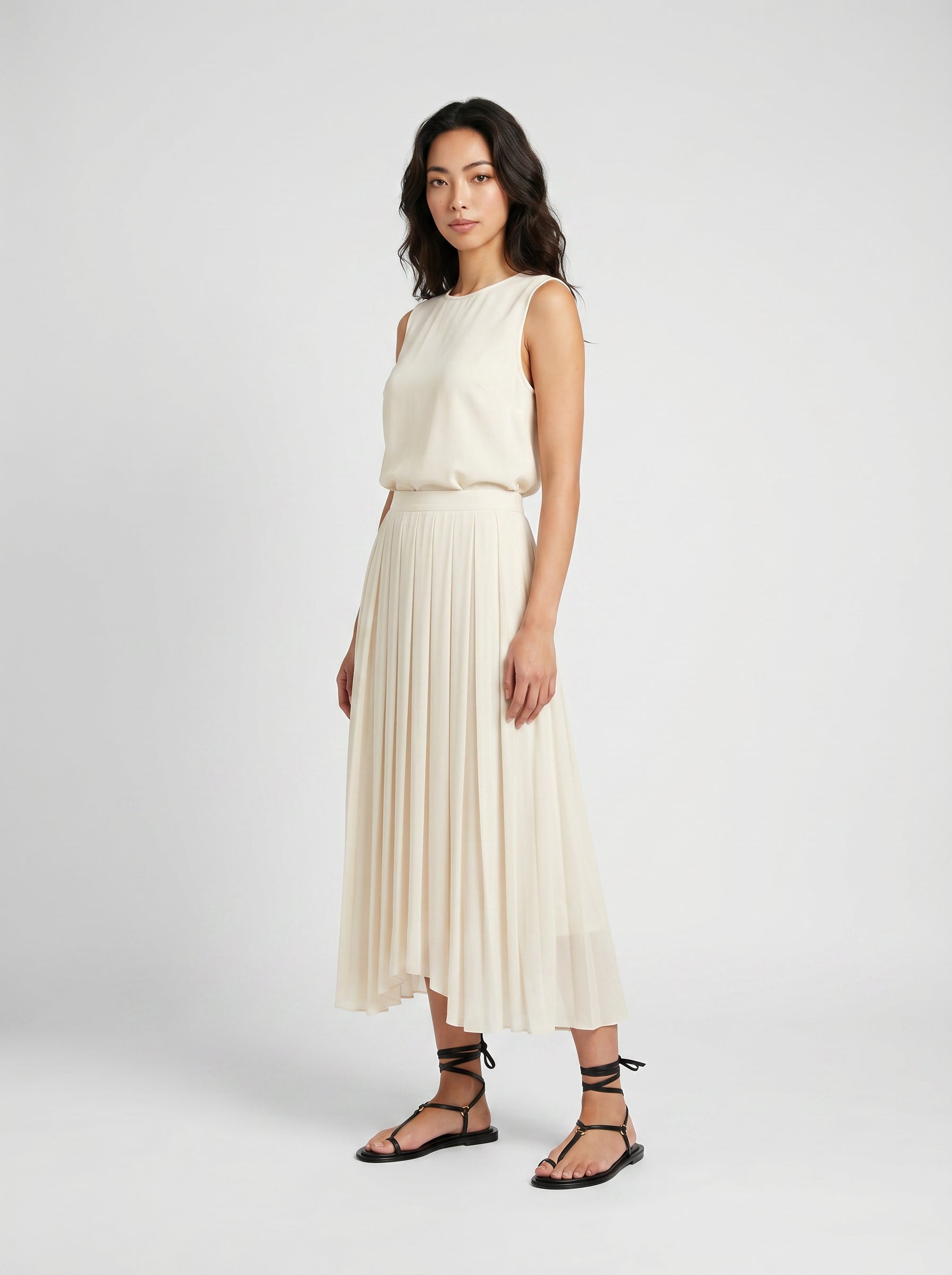 creme pleated organic silk skirt on model three quarter view