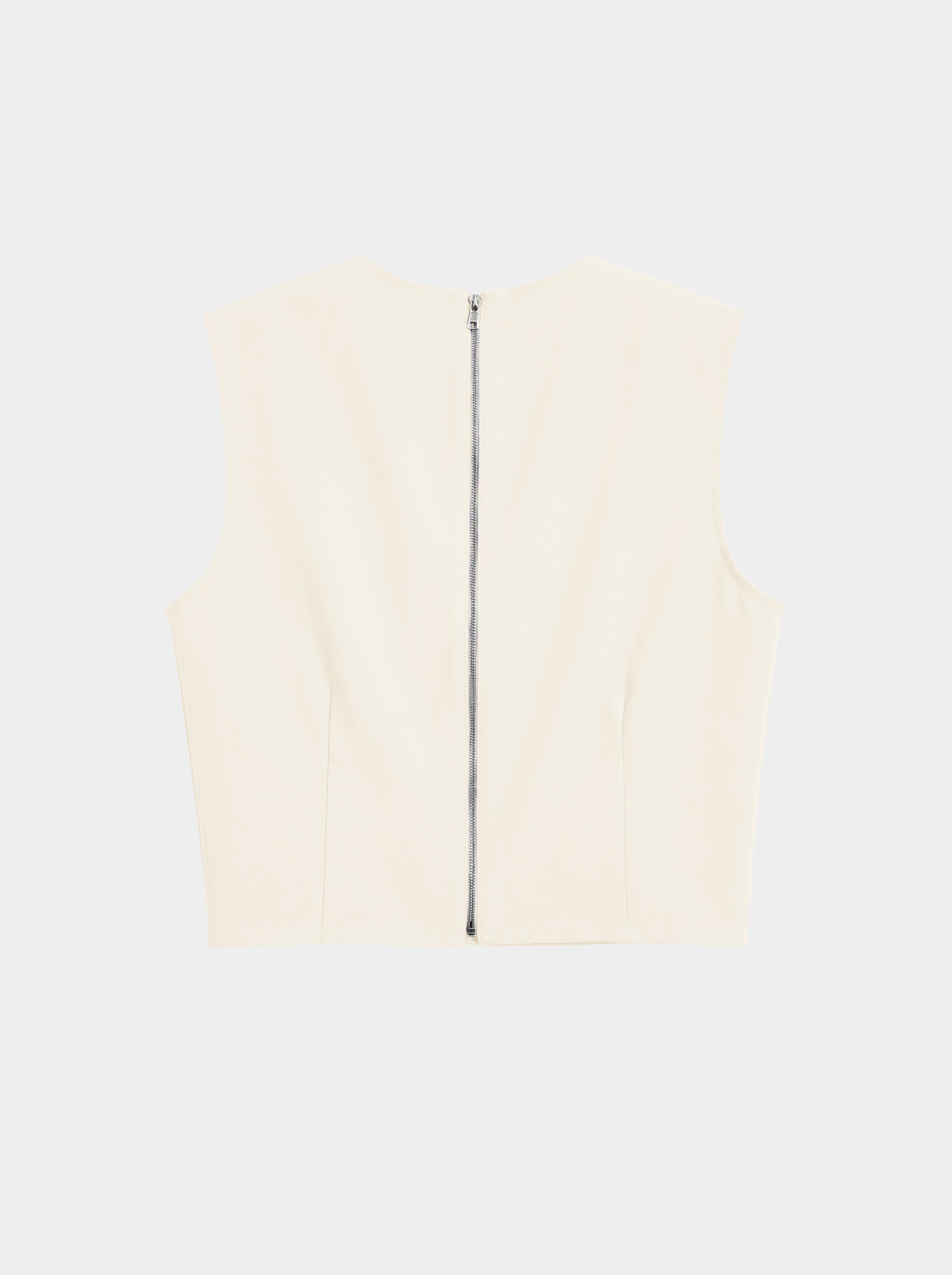 creme color Wool bodice top with silk pleated skirt on model back view