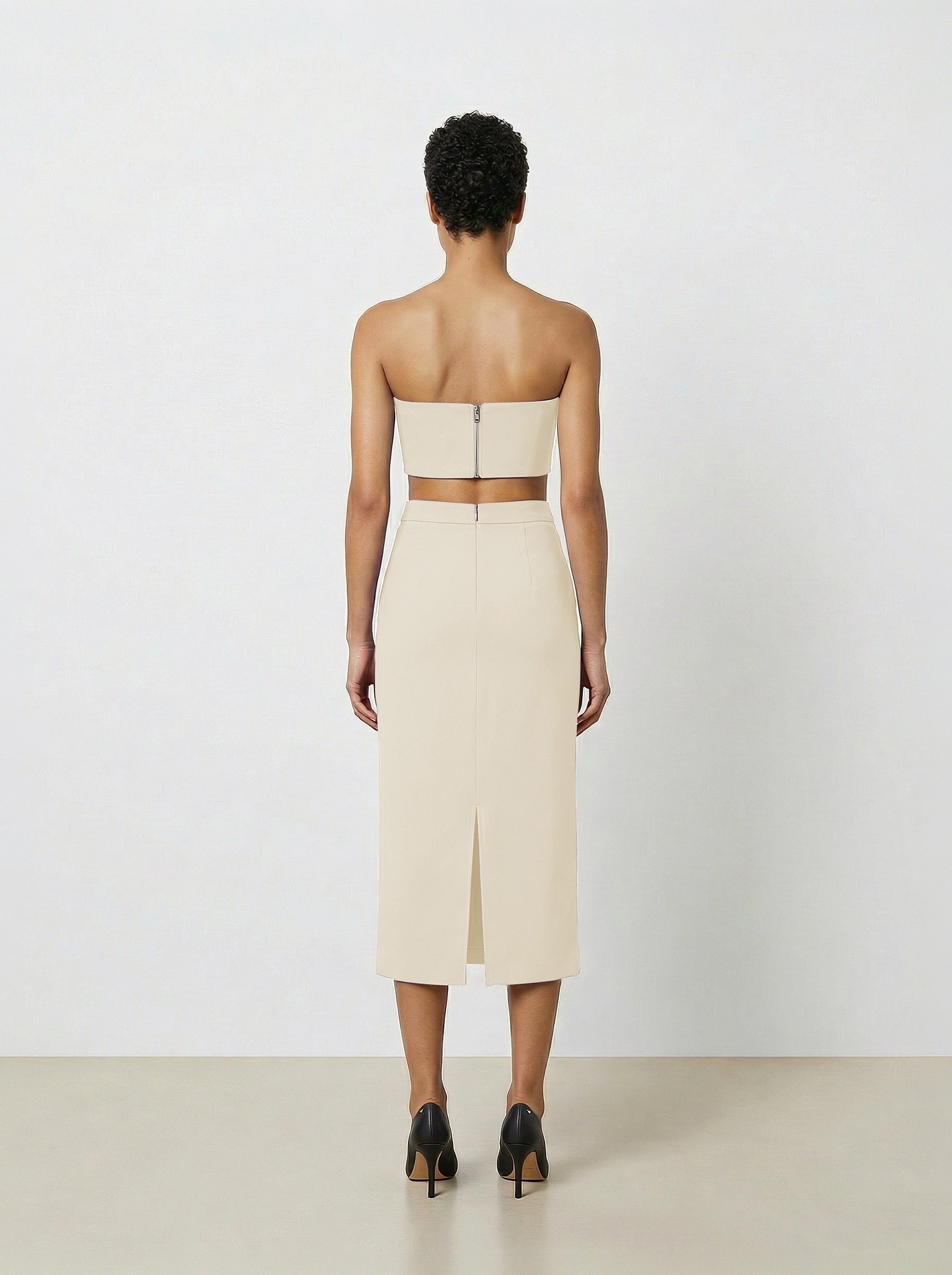 Creme wool pencil skirt on  back of model with white background