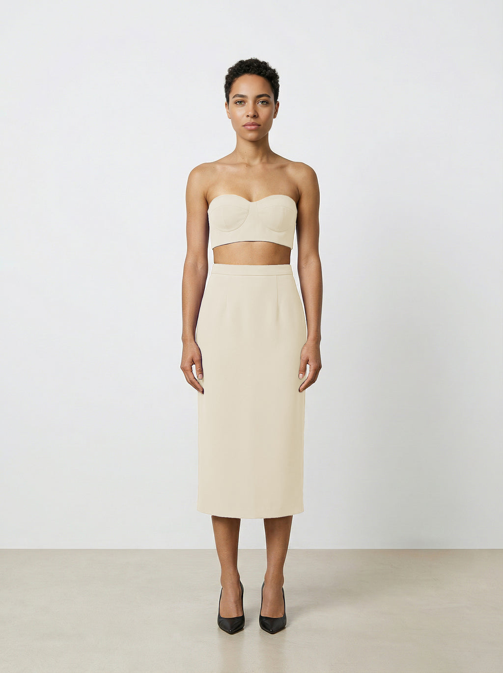 Creme wool pencil skirt on model with white background