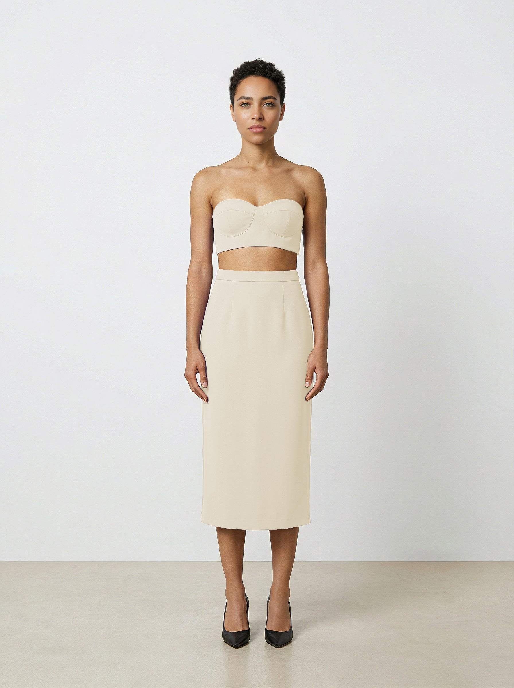Creme wool pencil skirt on model with white background