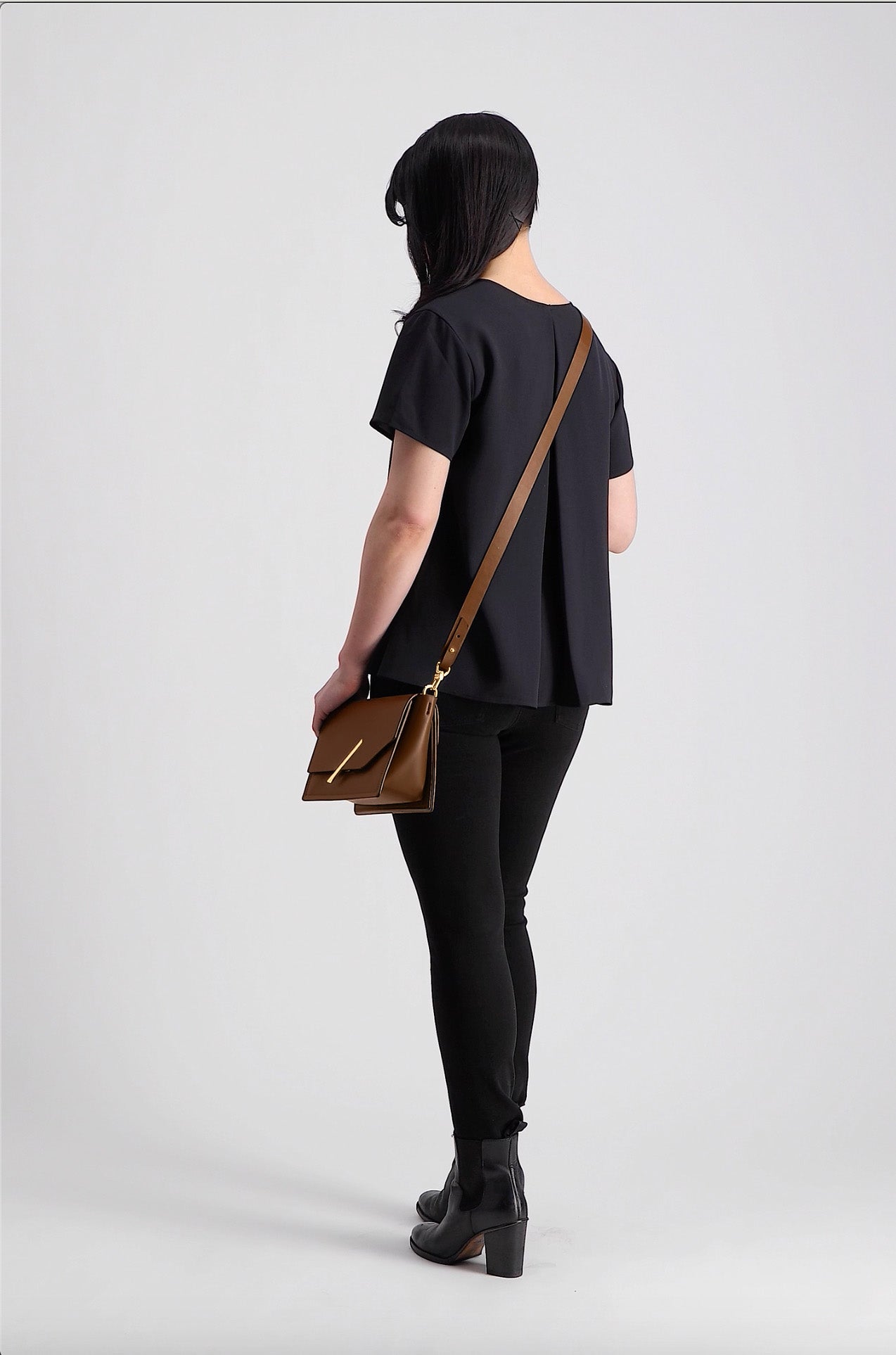 Novae Res Jemison Minor Leather Handbag made in Brown Leather and Gold Hardware with Crossbody Strap On Model
