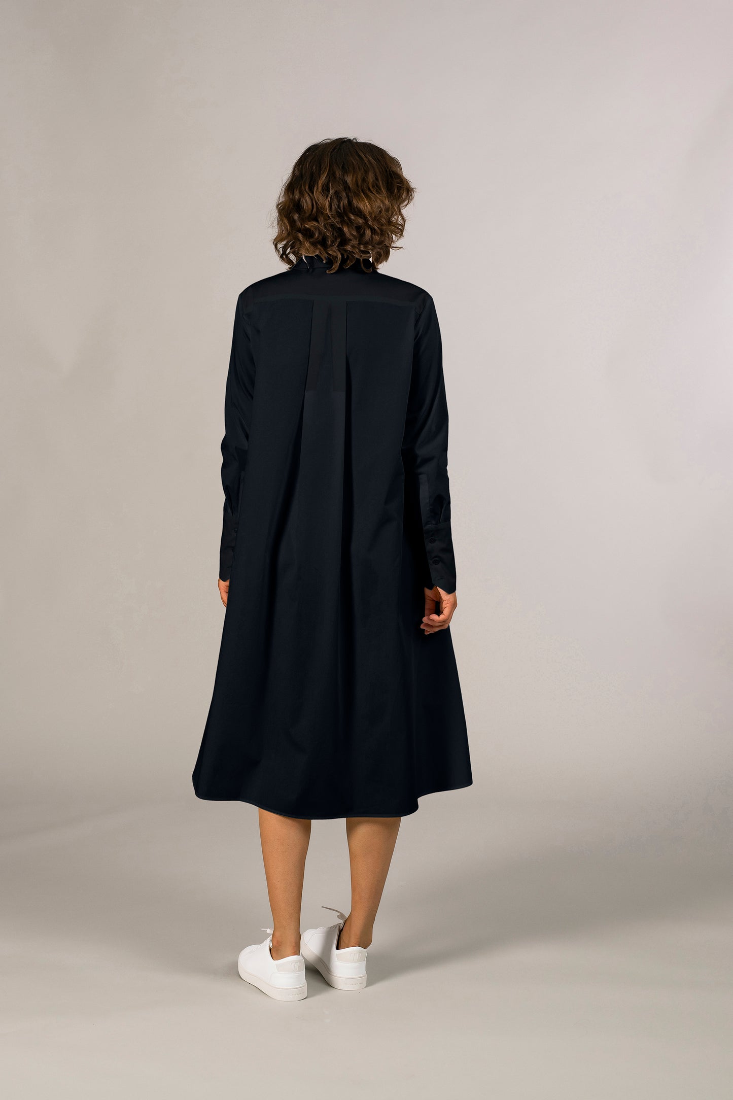 Back view of womens navy tuxedo shirt dress, 100% sustainable cotton poplin from Italy, long sleeve, button down knee length.