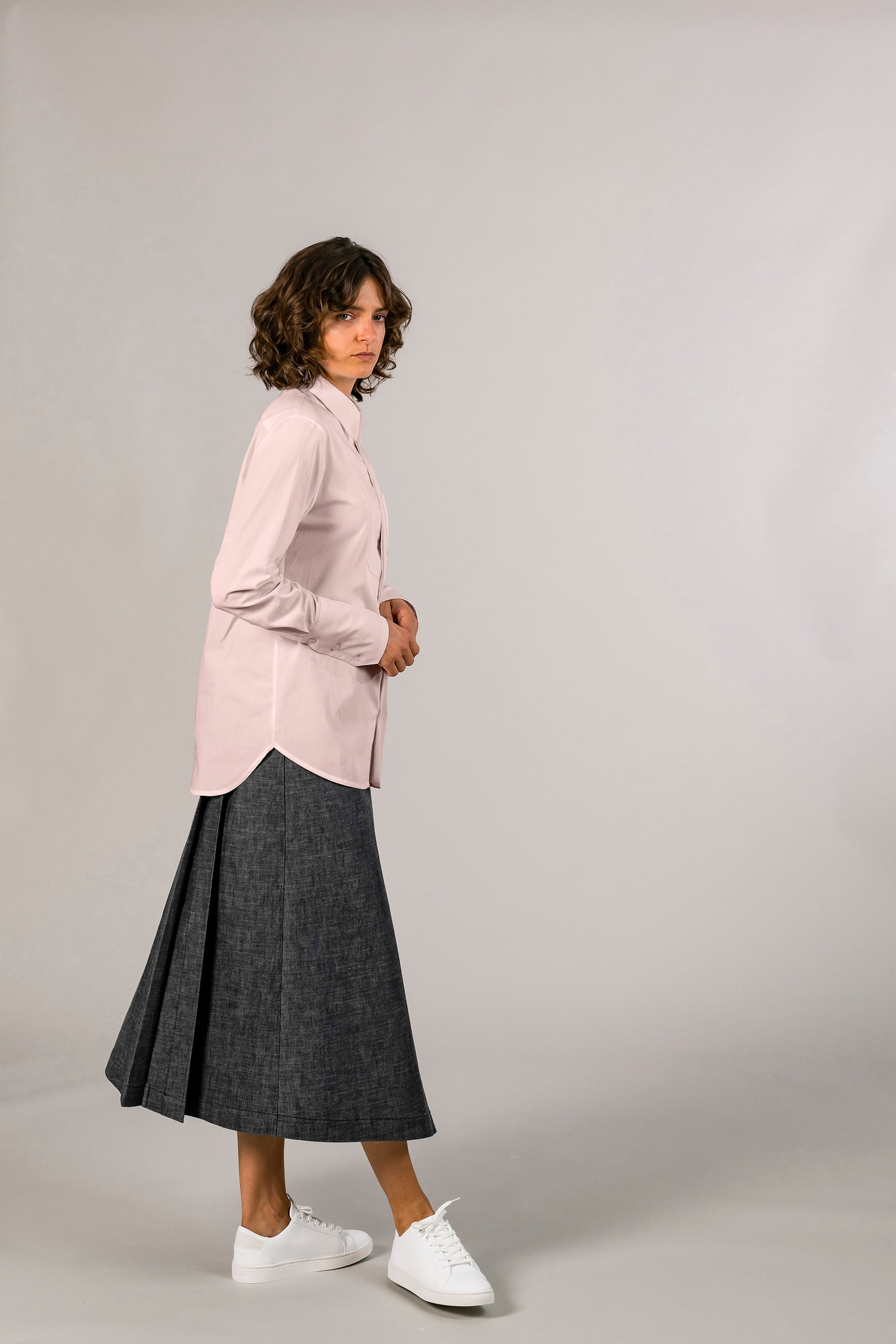 Side view of womens pink tuxedo shirt, 100% sustainable cotton poplin from Italy, long sleeve.